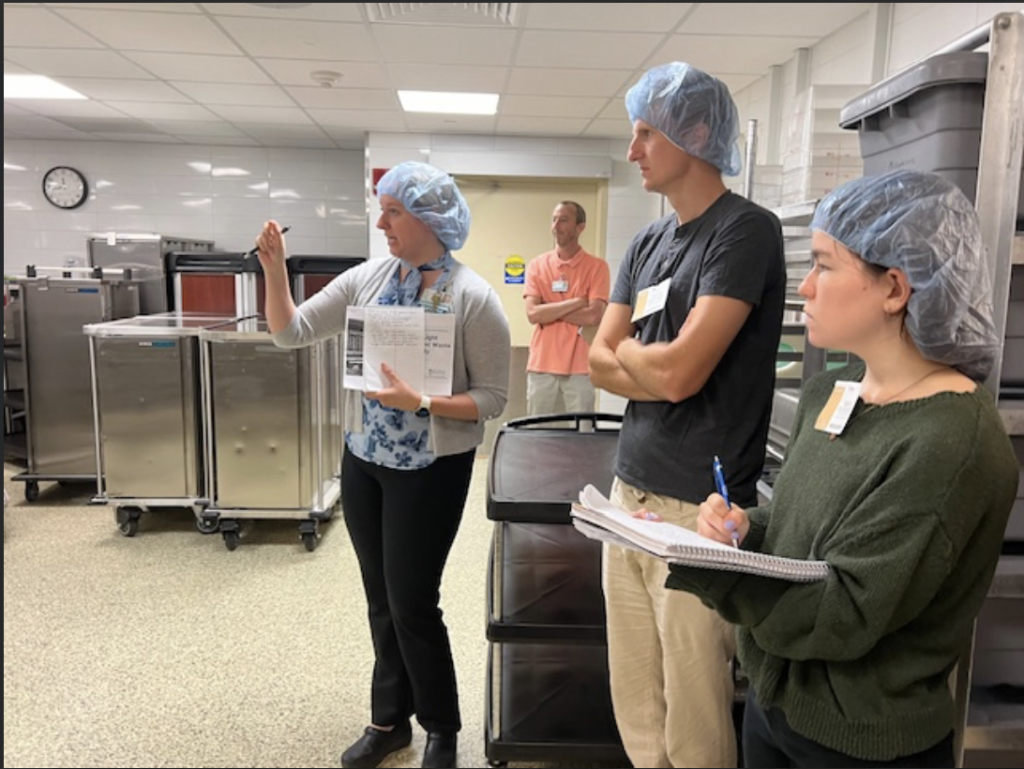 Three people with hairnets